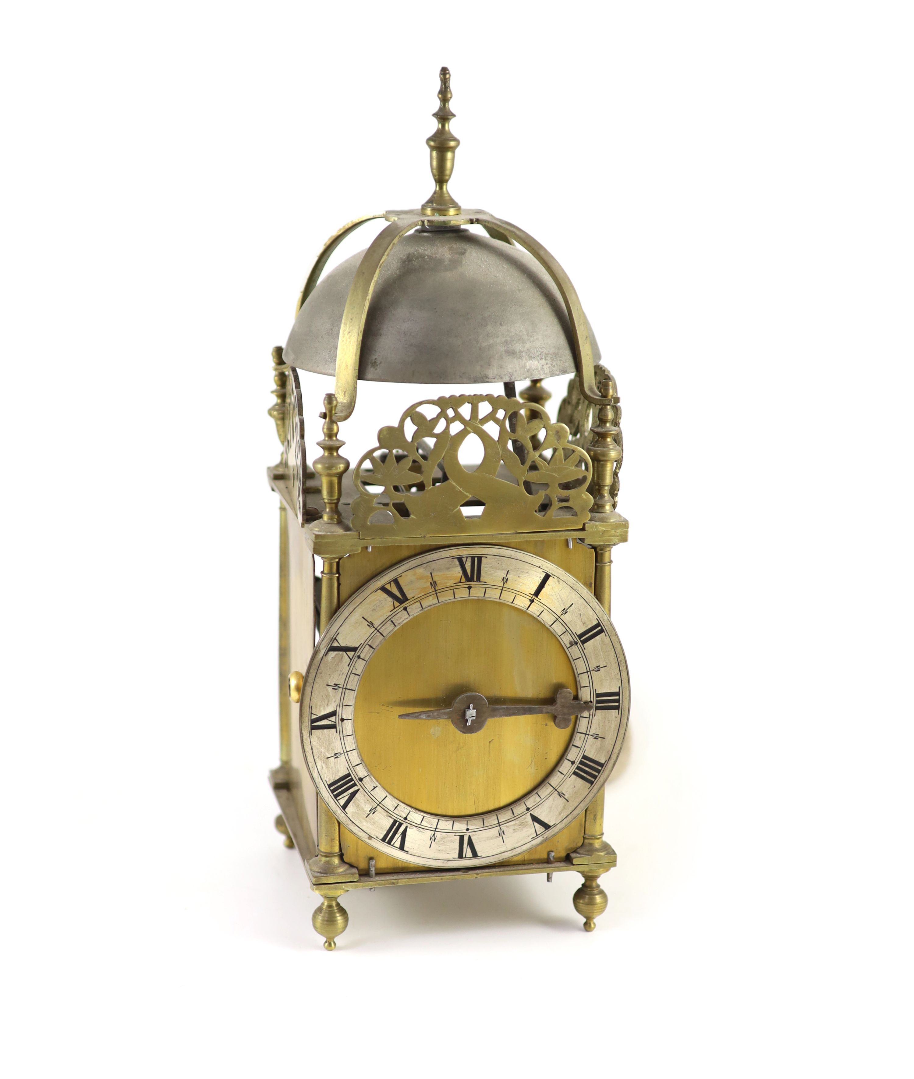 A 17th century style brass lantern clock width 15cm depth 15cm height 40cm